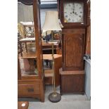 An early 20th Century standard lamp having wood base and brass column