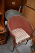 A pair of woven fibre tub chairs, in blue and pink