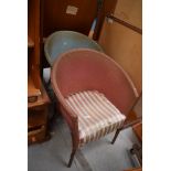 A pair of woven fibre tub chairs, in blue and pink