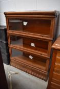 An Edwardian stackable glass fronted oak display or book case