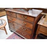 A 19th Century mahogany chest of two over three drawers having brass drop handles and scroll bracket