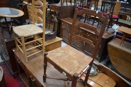 An interesting and naive style rush seated ladderback chair, having turned cross stretcher