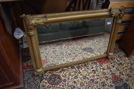 A gilt frame over mantel mirror, width approx 96cm width, some broken pieces to foliate decoration