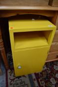 A vintage painted ply bedside cabinet, in yellow