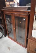 A stained frame bookcase top