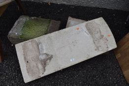 A deconsecrated grave or head stone having been converted to garden bench