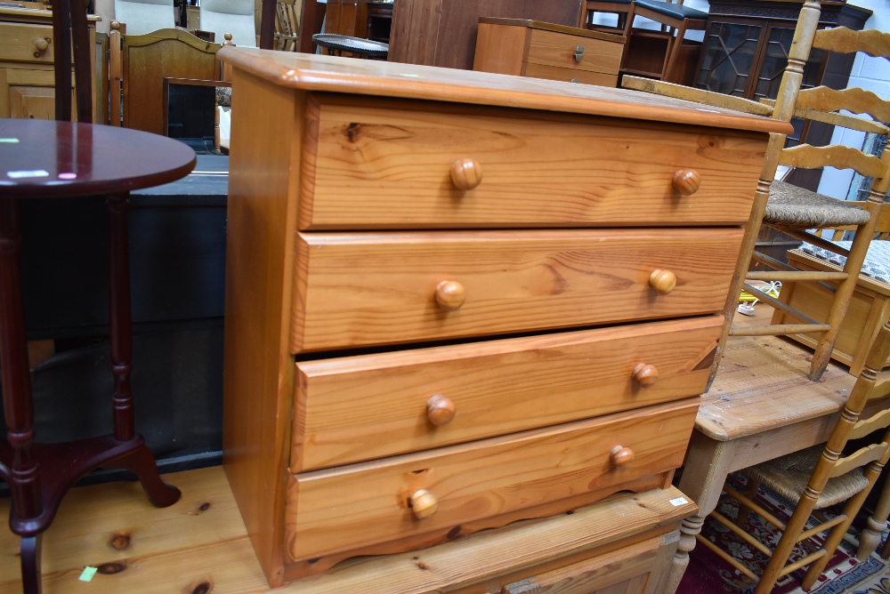 A modern pine chest of four long drawers