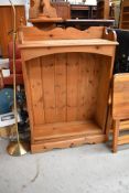 A modern natural pine floor standing bookshelf