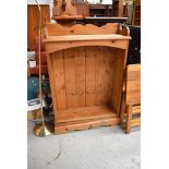 A modern natural pine floor standing bookshelf