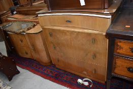 A vintage walnut veneer dressing table and bedroom drawers, stylised design, Beautility or similar