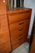 A Vintage teak bedroom chest of six (five plus one concealed frieze) drawers