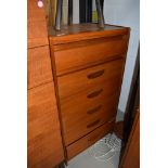 A Vintage teak bedroom chest of six (five plus one concealed frieze) drawers