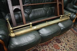 A brass adjustable fire fender