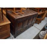 A period oak four panelled kist/coffer , carved frieze bearing date 1799, monogram MB, two drawers