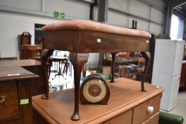 A piano or similar box lid foot stool