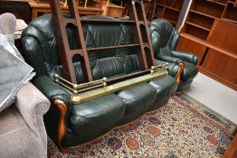 A green leatherette sett and chair, having wood frame