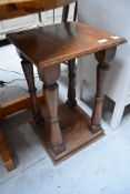 An Edwardian oak hall or plant stand