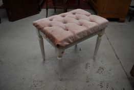 A vintage dressing table stool
