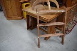 A 1930s walnut drawer leaf table and a clothes horse