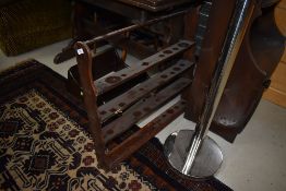 Two dark stained Ercol wall shelves