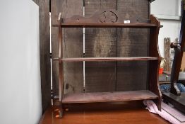 An early 20th Century flame mahogany bookcase/display cabinet, glazed centre section flaked by