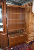 A vintage laminate teak effect wall unit, width 84cm