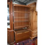 A vintage laminate teak effect wall unit, width 84cm