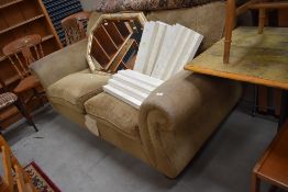A modern two seater settee coach in good condition from sofa classics