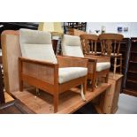 A pair of 1970s lounge chairs , frames possibly elm, canework sides