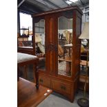 A Victorian mahogany mirror door wardrobe having single drawer base