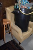 A reproduction wing back armchair