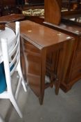 A solid wood drop leaf kitchen or utility table