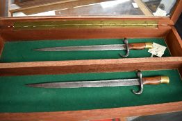 Two miniature possibly French Gras Rifle Bayonets, blade length 26cm, overall length 33cm, no