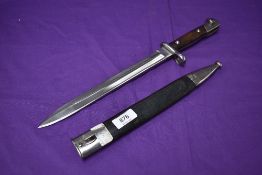 A German Seitengewehr 1871/84 Model Bayonet, with wood and metal hilt, blade marked Alex Coppel