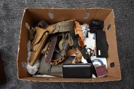 A collection of Military Memorabilia including modern folding Trench Spade, Cartridge Belt, Brass