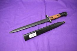 A Belgium FN 1949 Export Bayonet with metal scabbard, no marks seen, blade length 23cm, total length