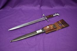 A Swiss Schmidt-Rubin Model 1931 Bayonet with metal scabbard and leather frog, marked on