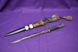 A WW2 German Dress Bayonet 1939-45 with single quillion crossguard, leather frog and portepee