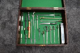 A wood case containing 23 miniature Swords and Daggers including Fairbairn Sykes Commando Dagger,