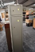 A modern metal gun cabinet, height approx 151cm, no key and locked