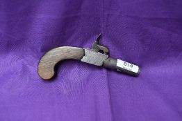 A 19th century Percussion Box Lock Pocket Pistol with foldaway trigger and screw off barrel,