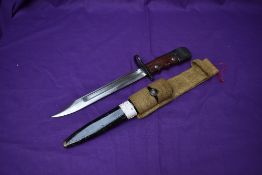 A British 1945 No7 MK1 Knife Bayonet for the No4 Rifle, swivelling pommel, metal scabbard and