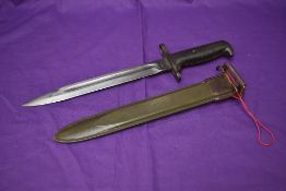 An American Bayonet for Garand M1 Rifle, model M1 1943, blade marked US UFH, metal scabbard, overall