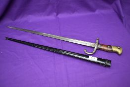 A French Gras Rifle Model 1874 Bayonet with scabbard, marked on crossguard 49214, blade marked 1876,