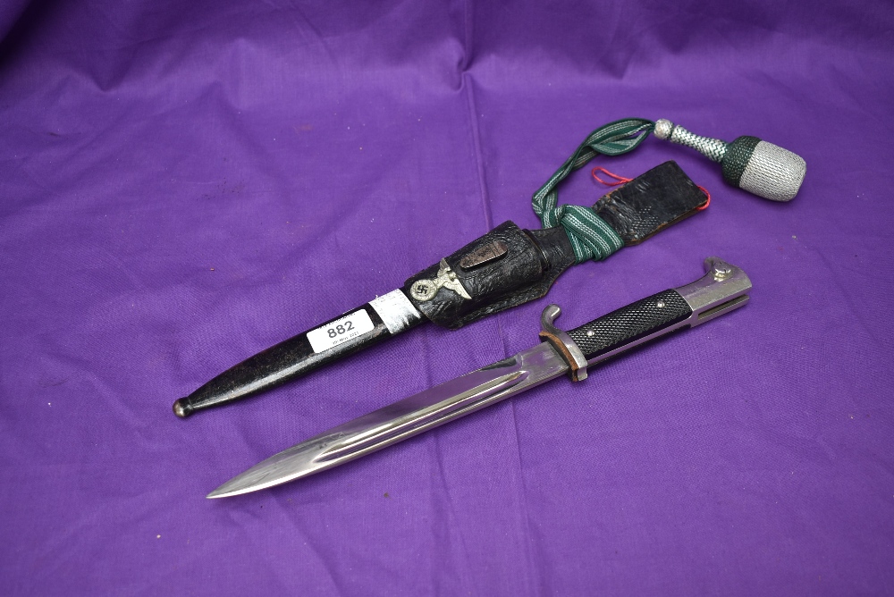 A WW2 German Dress Bayonet 1939-45 with single quillion crossguard and silver wire portepee knot,