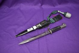 A WW2 German Dress Bayonet 1939-45 with single quillion crossguard and silver wire portepee knot,