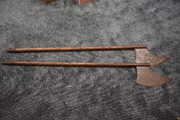 A pair of reproduction medieval metal studded Long Handled Executioners Axes overall length 160cm