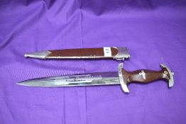 A German WWII SA Service Dagger 1933 with brown scabbard, brown grip, blade marked Alles Fur