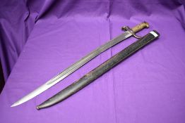 A French Sabre Bayonet model 1842 with re-curved blade, solid brass hilt and metal scabbard,