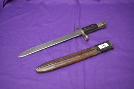 A Canadian WW1 Ross MK1 Bayonet unmodified with metal and leather scabbard, made by Ross Rifle